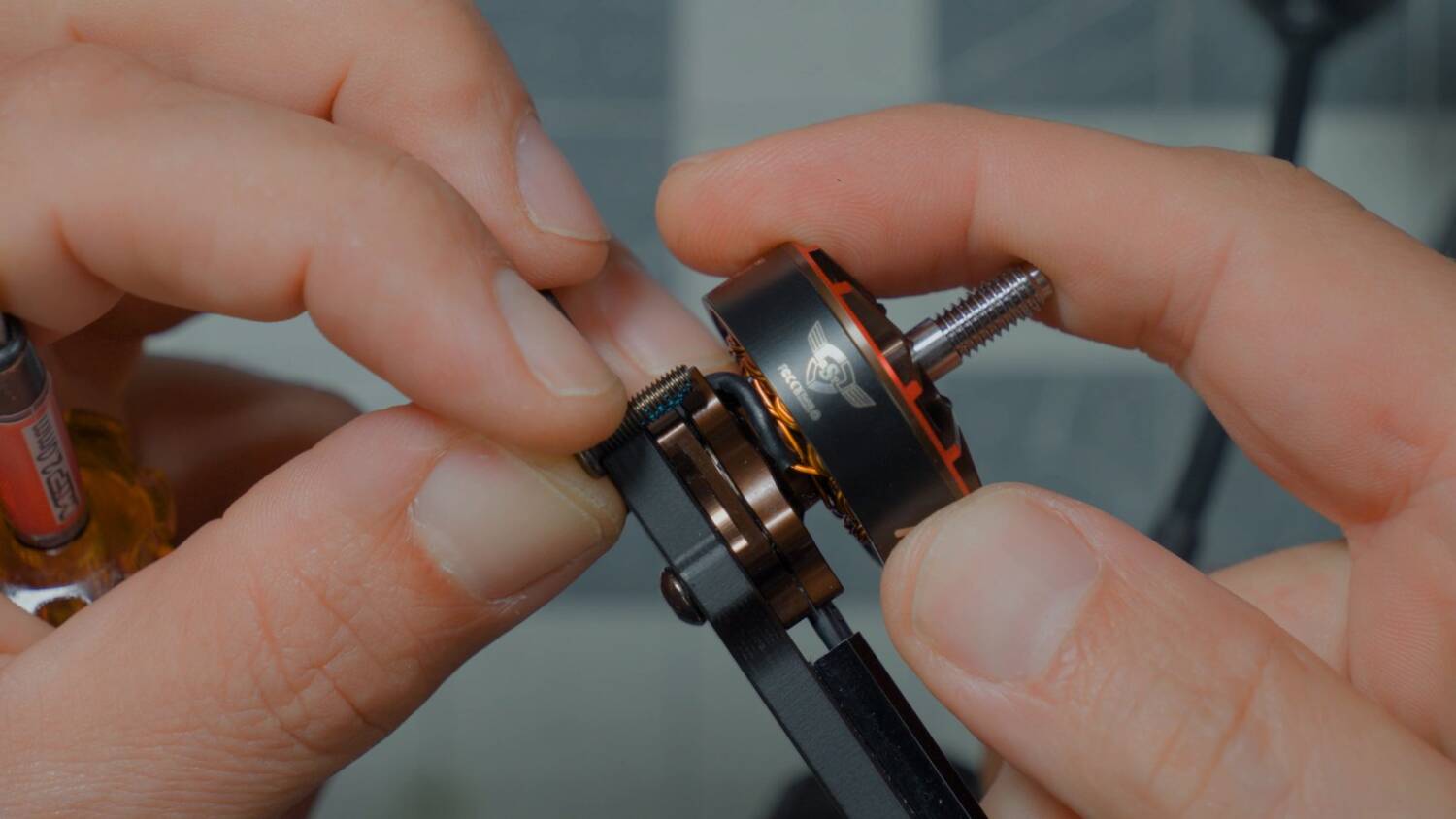 Fitting one of the screws that came with the motor