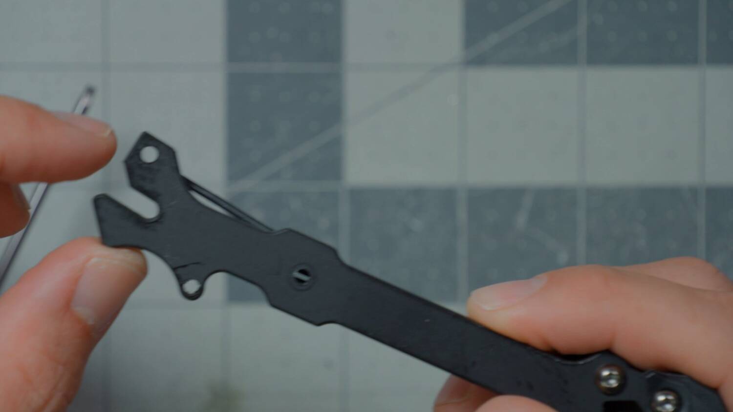 The slit in the arm where the stack screw sits