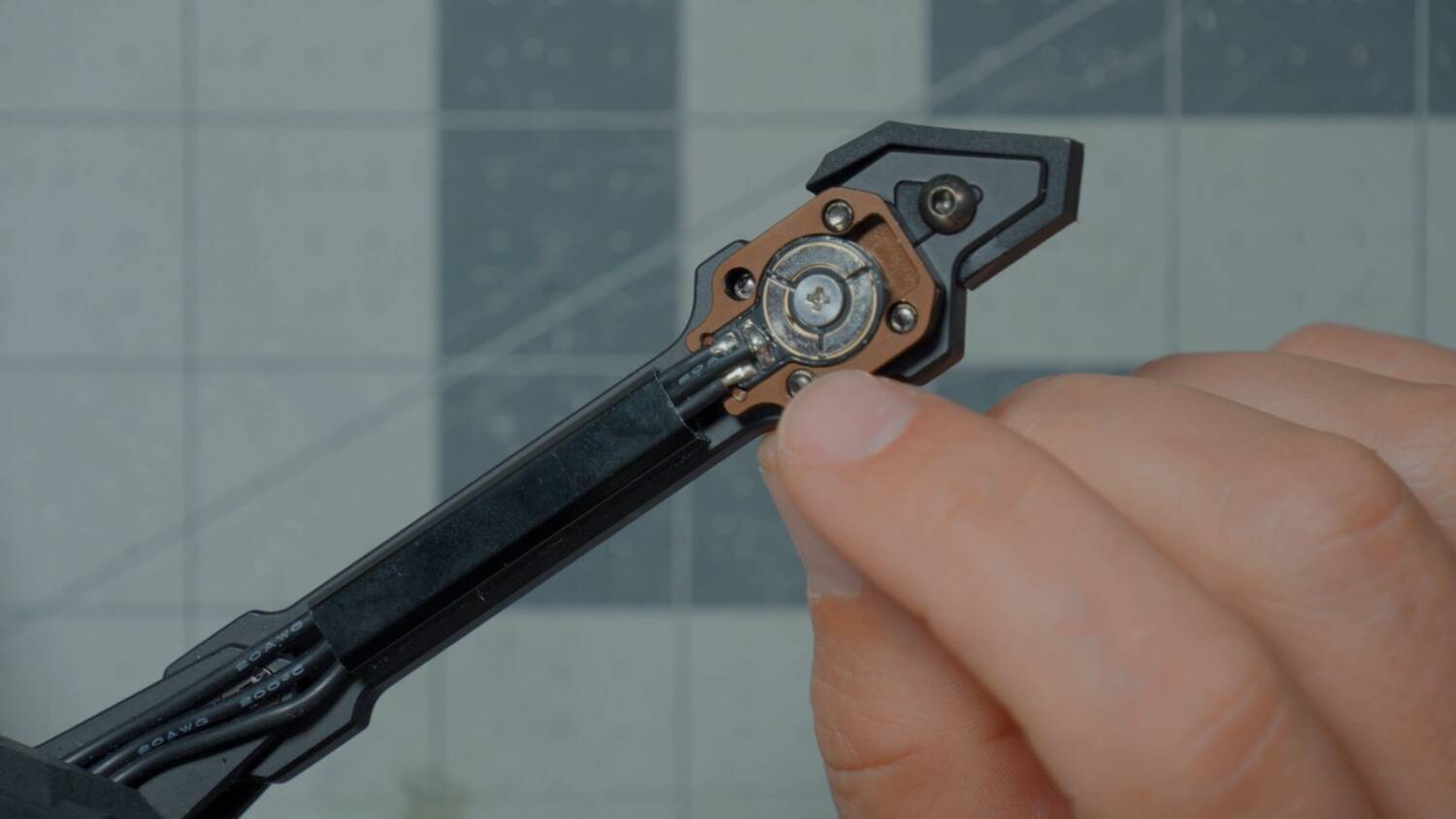 A motor base left on the arm with the motor removed