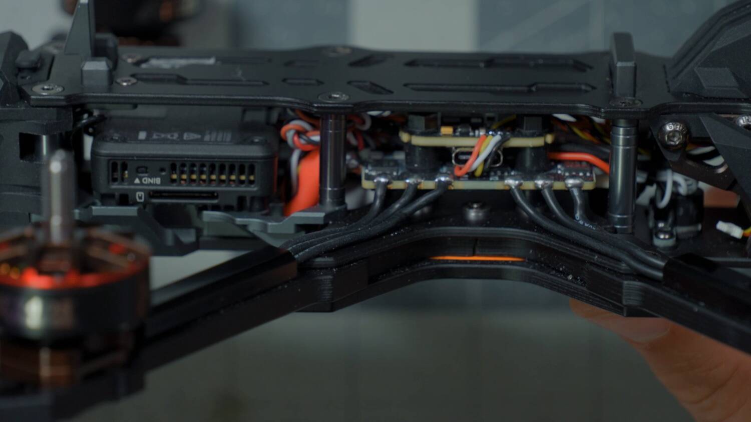 The big ESC and tiny flight controller inside