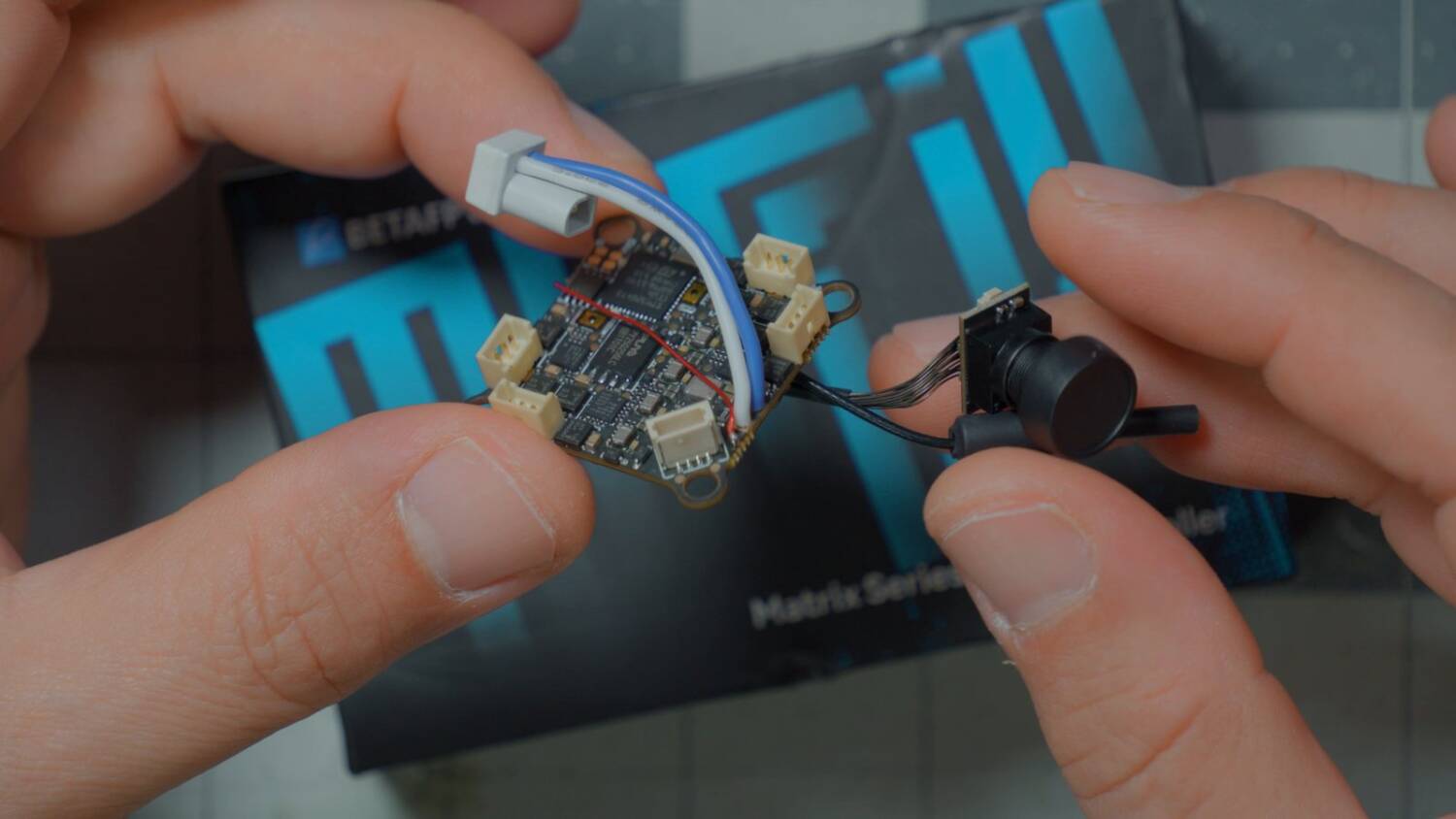 The BetaFPV Matrix flight controller with its camera