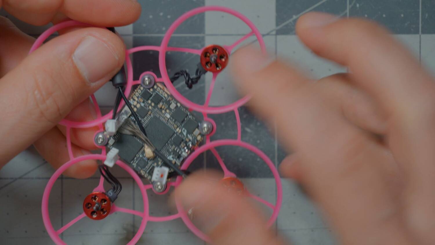 The motor plugs and the solder pads on top of the flight controller