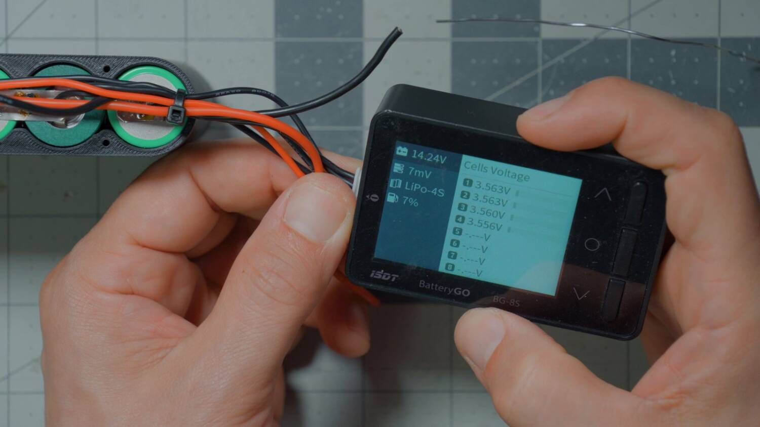 Cell checker showing 14.24V and four cells at about 3.56V each