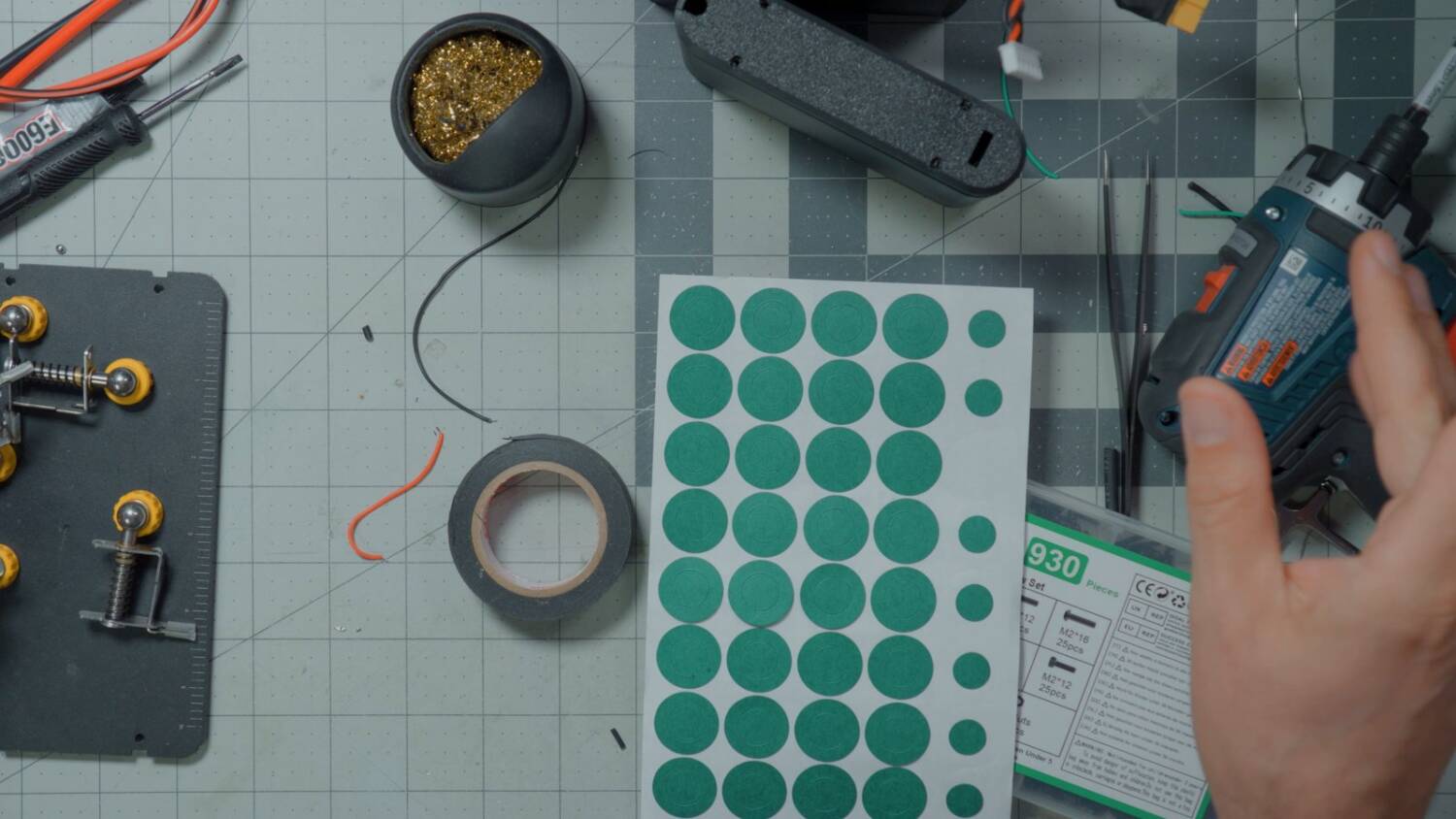 Sheet of green fish paper rings