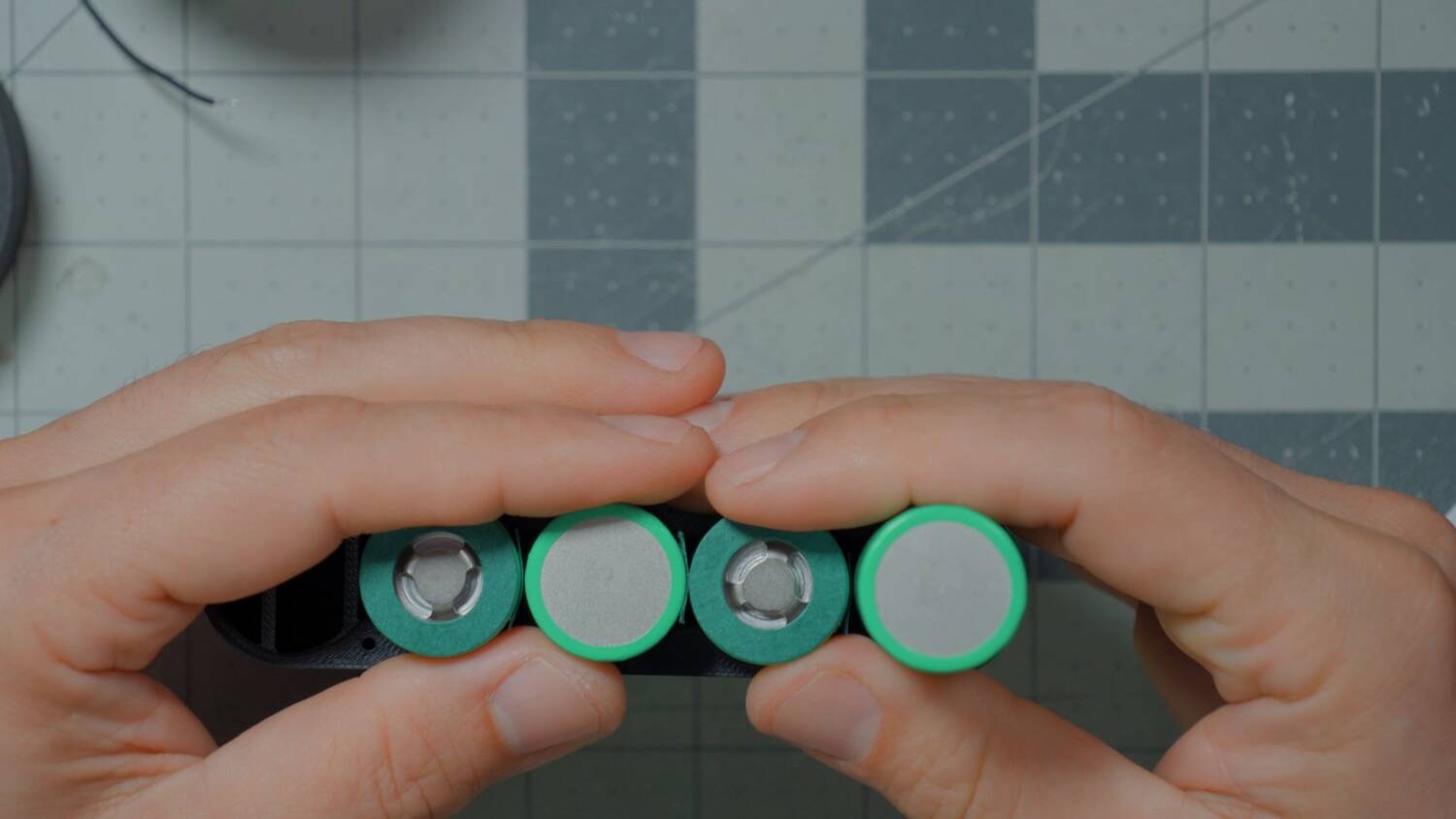 Four cells standing side by side, alternating up and down