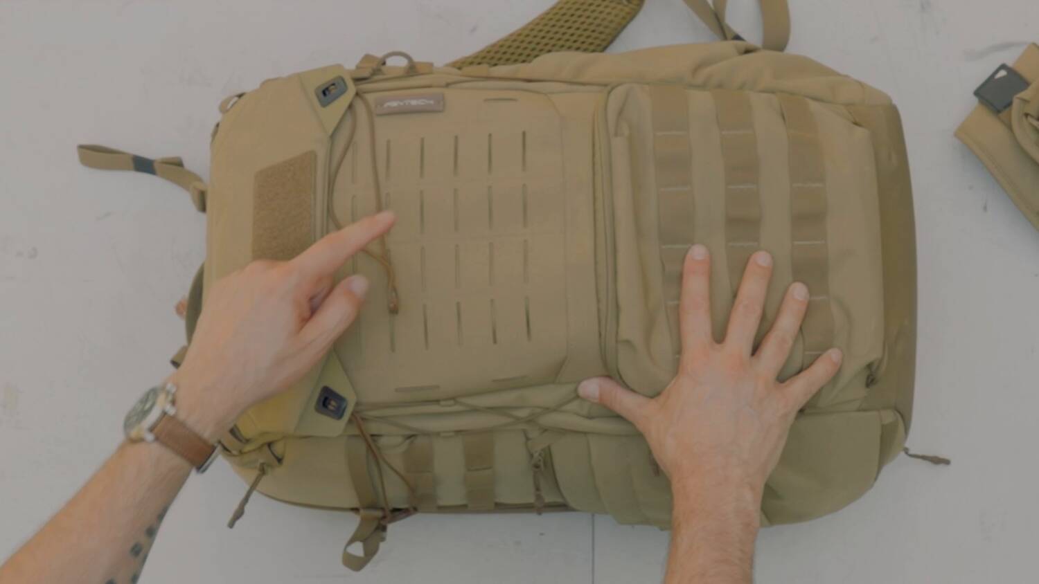 Side pocket and laser-cut webbing